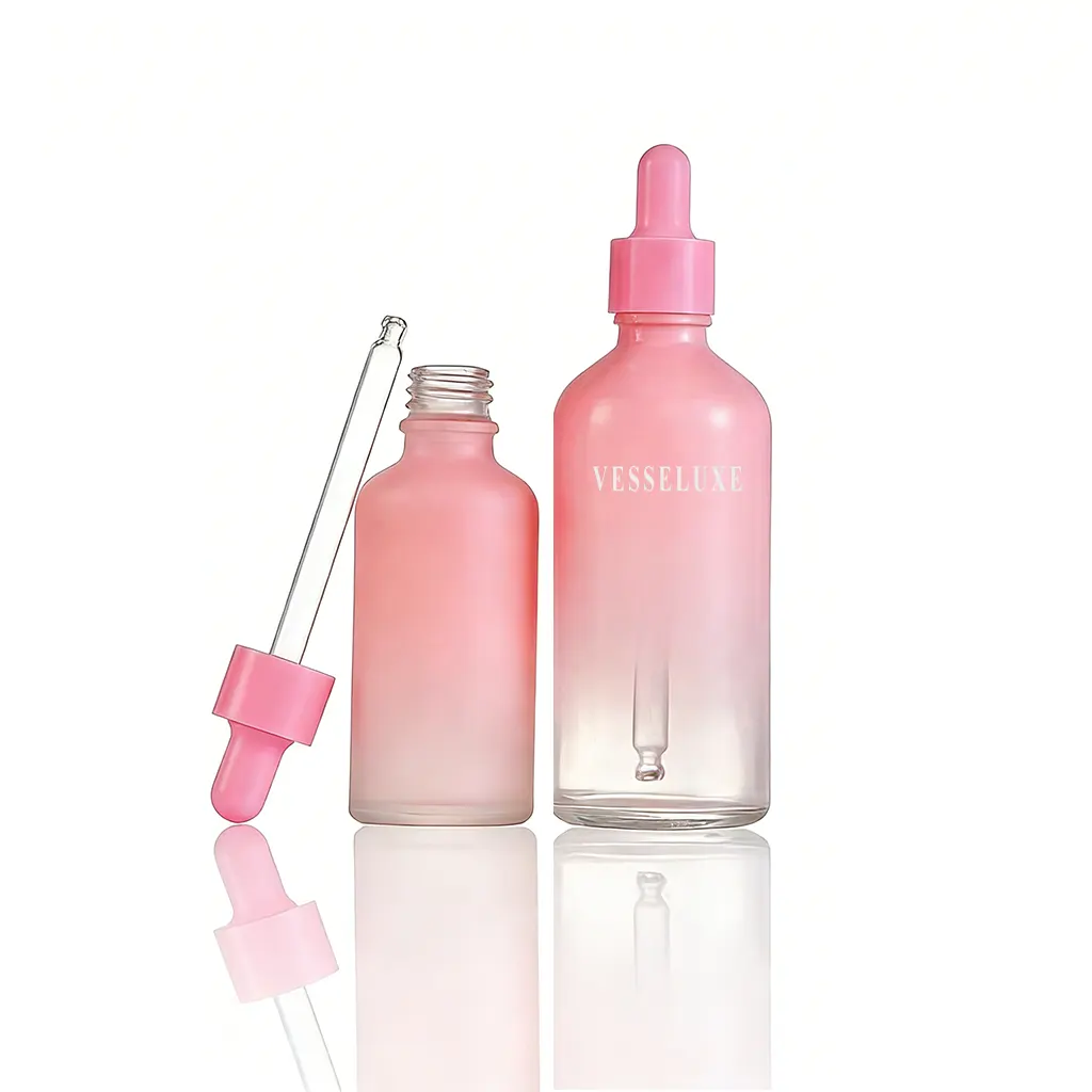 Frascos de vidrio rosa con gotero